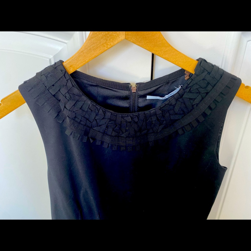 Beautiful black sheath dress with detailed neckline. Very smart!